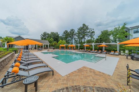 Sparkling swimming pool and spacious sundeck at The Oxmoor in Birmingham, AL